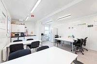 Modular building canteen area, with kitchenette, tables, and chairs
