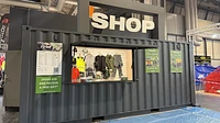 Shipping container shop with serving hatch and custom signage