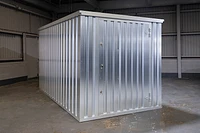 Flat Pack storage container front, door closed, galvanised steel finish