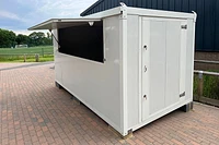 Flat Pack insulated kiosk, door end, serving hatch open, off-white finish