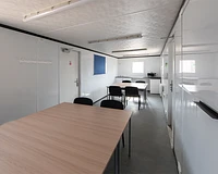 32ft canteen interior with kitchenette, tables and chairs