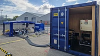 Switchgear shipping container unit with cable access panels and equipment