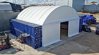 40ft and 10ft containers stacked on either side of a Zappshelter canopy