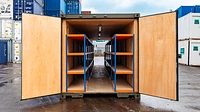 Tunnel shipping container with open doors, modified with ply lining and racking
