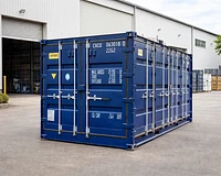 20ft side opening shipping container being loaded by a forklift