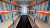 Shipping container with racking