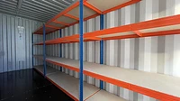 Container interior with racking shelves