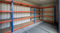 Shipping container with racking fitted