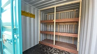 Container interior with custom pain and shelves