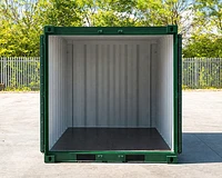 8ft shipping container in green with the doors open