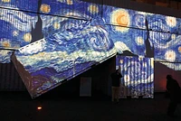 Van Gogh The Starry Night projected onto containers 