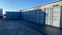 Grey Painted Shipping Containers Used As Storage Solution