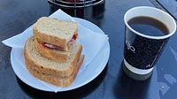 Bacon sandwich and black coffee 
