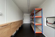 Container workshop with racking, folding workbench and electrics