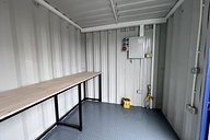 Container workshop with workbench, electrics and lighting
