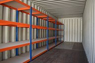 Container workshop interior with racking