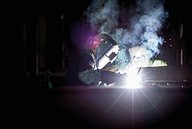 man welding metal