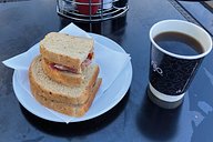 Bacon sandwich and black coffee 