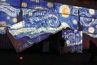 Van Gogh The Starry Night projected onto containers 