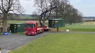 Two One Trip Green Tri Door Shipping Containers Being Delivered 