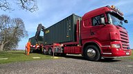 Two One Trip Green Tri Door Shipping Containers Being Delivered 