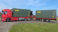 Two One Trip Green Tri Door Shipping Containers Being Delivered 