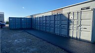 Grey Painted Shipping Containers Used As Storage Solution